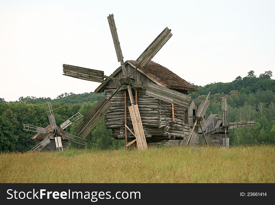 Four old wooden windmills picturesque scene. Four old wooden windmills picturesque scene