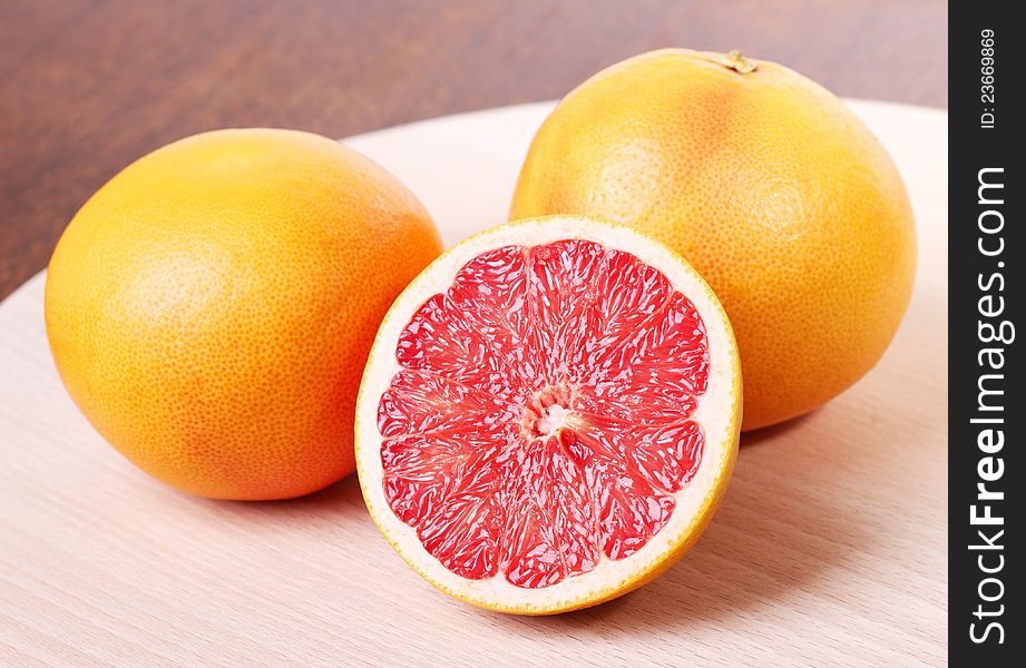 Fresh Red Grapefruit on Cutting Board