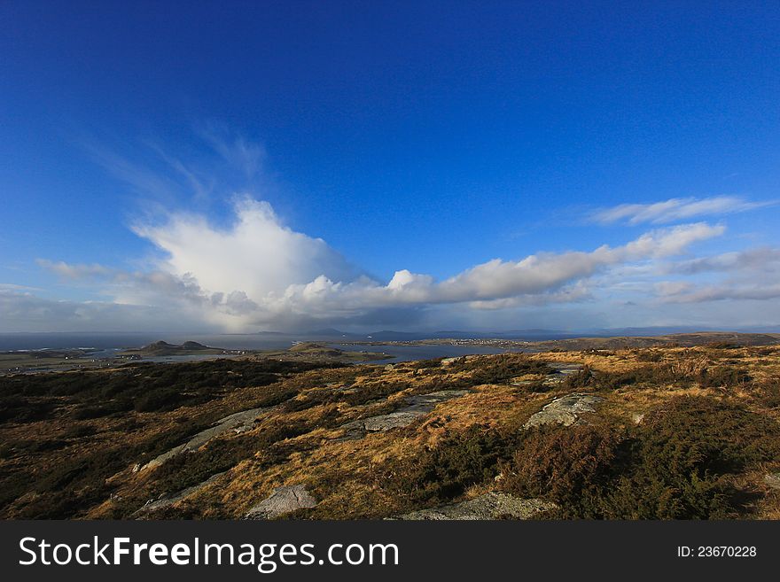 Rainclouds over an Island, seen from the island of Klosteroy, close to Stavanger, Norway
