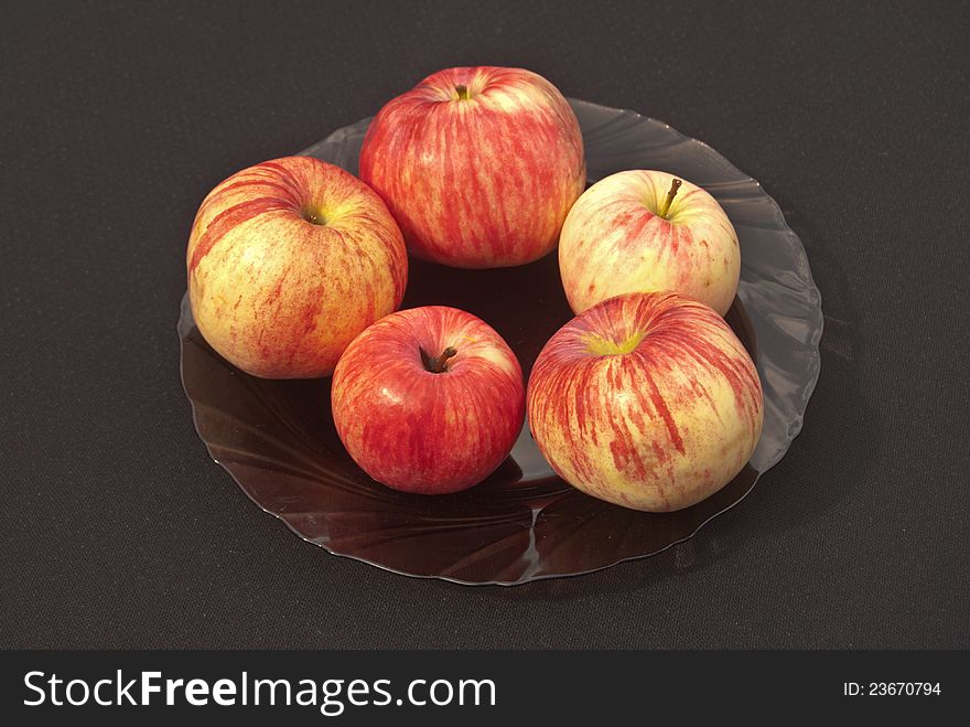 Apples On A Plate On A Black Background