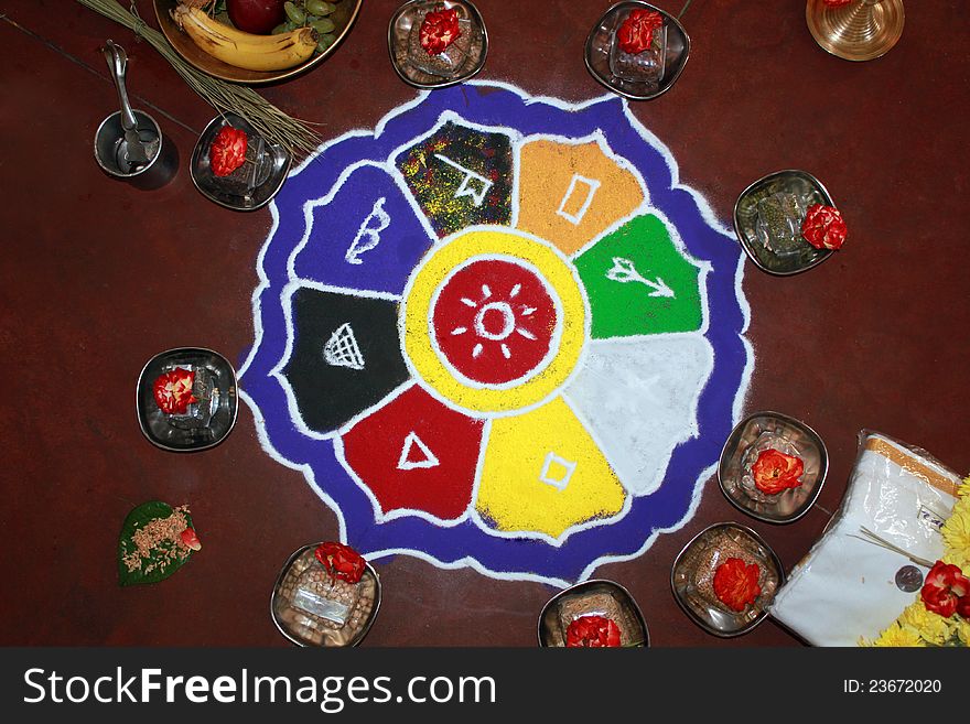 Colorful rangoli art with hindu puja items, flowers, dhoti and money. Colorful rangoli art with hindu puja items, flowers, dhoti and money