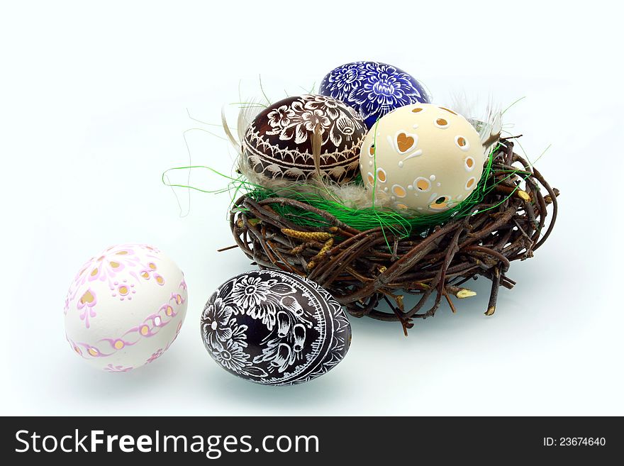 Easter eggs in the nest on a white background