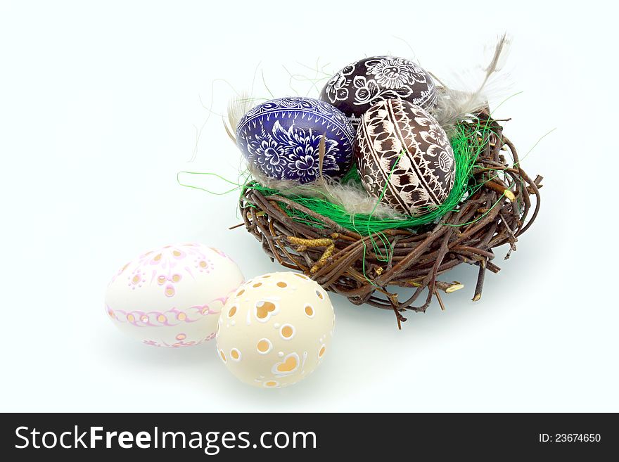 Easter eggs in the nest on a white background