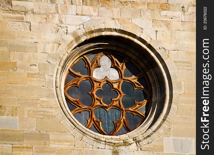 Circular window from a church built with stones