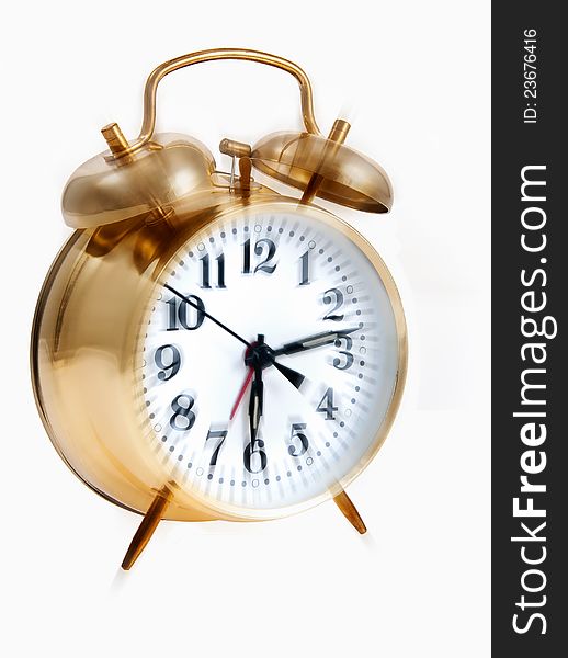 Wind-up alarm clock with bells going off. Wind-up alarm clock with bells going off