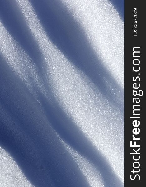 Background created by the undulations of a snow surface