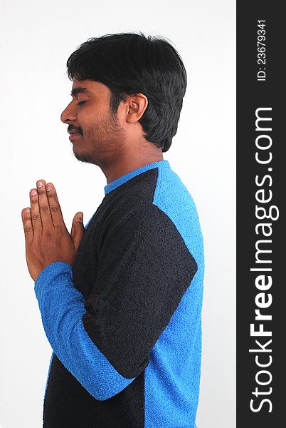 Photo of handsome youth praying with white background. Photo of handsome youth praying with white background
