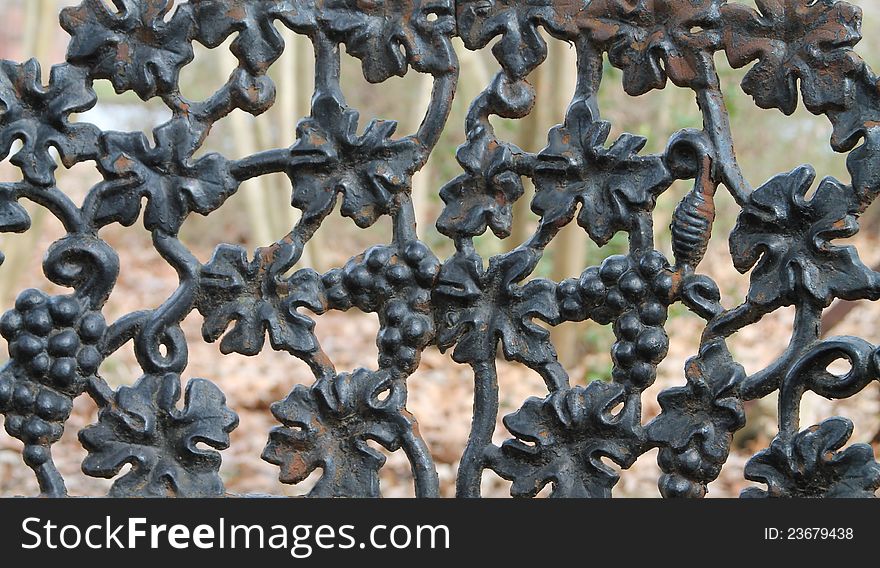 Antique wrought iron bench found in a park in Memphis, Tennessee. Antique wrought iron bench found in a park in Memphis, Tennessee