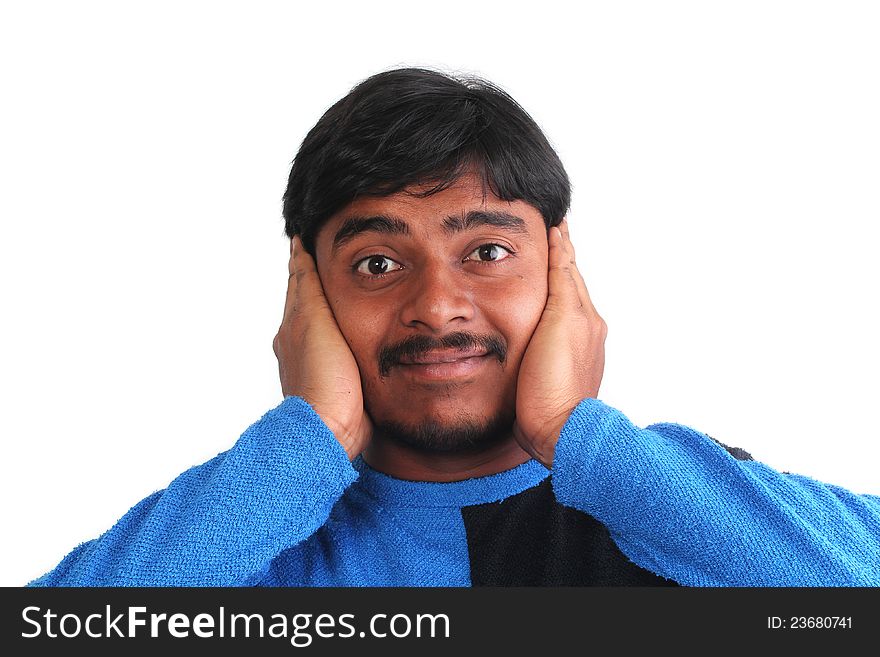 Indian male showing distress by covering his ears with hand with expressive face