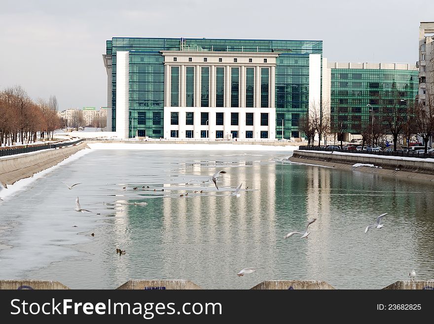 Modern building on a river bank