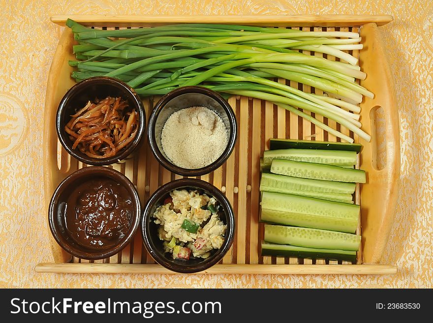 Chinese appetizers .  green onions and cucumbers