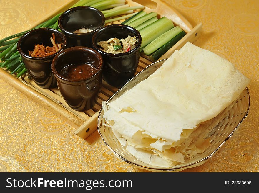 Chinese traditional pancake .eat With green onions and cucumbers. Chinese traditional pancake .eat With green onions and cucumbers