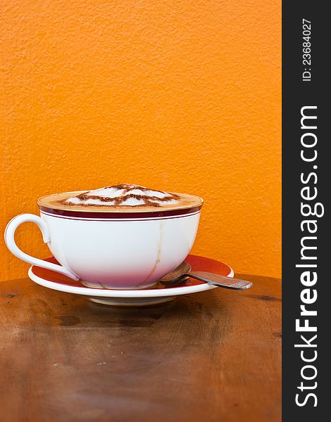 Cappuccino In White Cup On Table