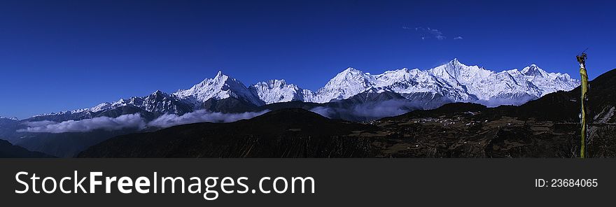 Meili Xue Shan (Chinese translation: Mainri snowy range) or Mainri Snow Mountains are a mountain range in the Chinese province of Yunnan. They lie close to the northwestern boundary of the province and are bounded by the Salween River on the west and the Mekong on the east.[1] The crest of the range rises to over 6,000 metres (20,000 ft) above sea level, making for impressive prominence over the river valleys to the east and west, which are between 1,500 metres (4,900 ft) and 1,900 metres (6,200 ft) in elevation. The highest peak is Kawagebo, which rises to 6,740 metres (22,110 ft). Kawagebo is considered sacred for Tibetan Buddhists. Other significant peaks include Mianzimu, Peak 6509 and Jiariren-an. Because of restrictions and dangerous conditions, none of the major peaks in the range have ever been summited.