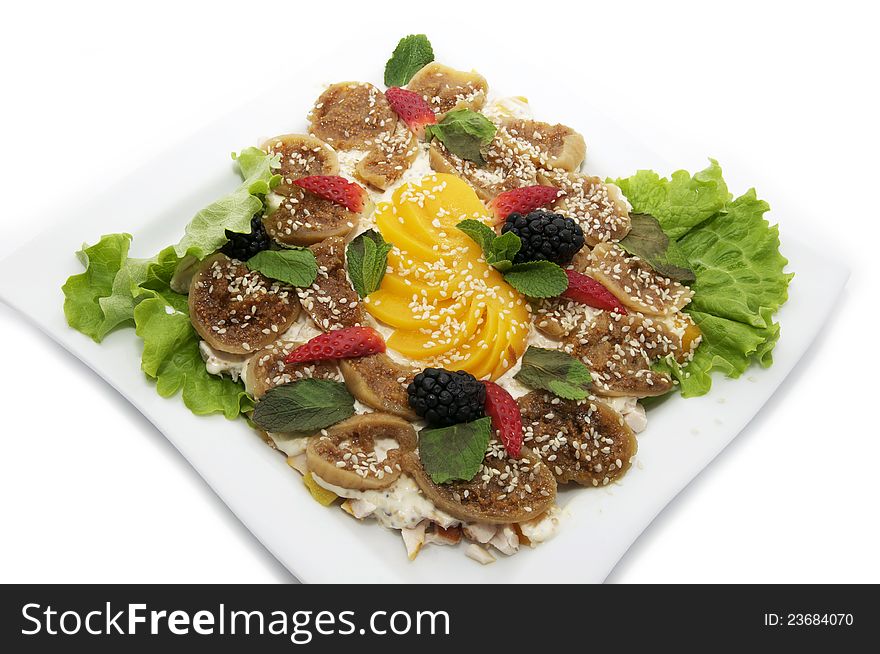 Salad with figs on a plate on a white background