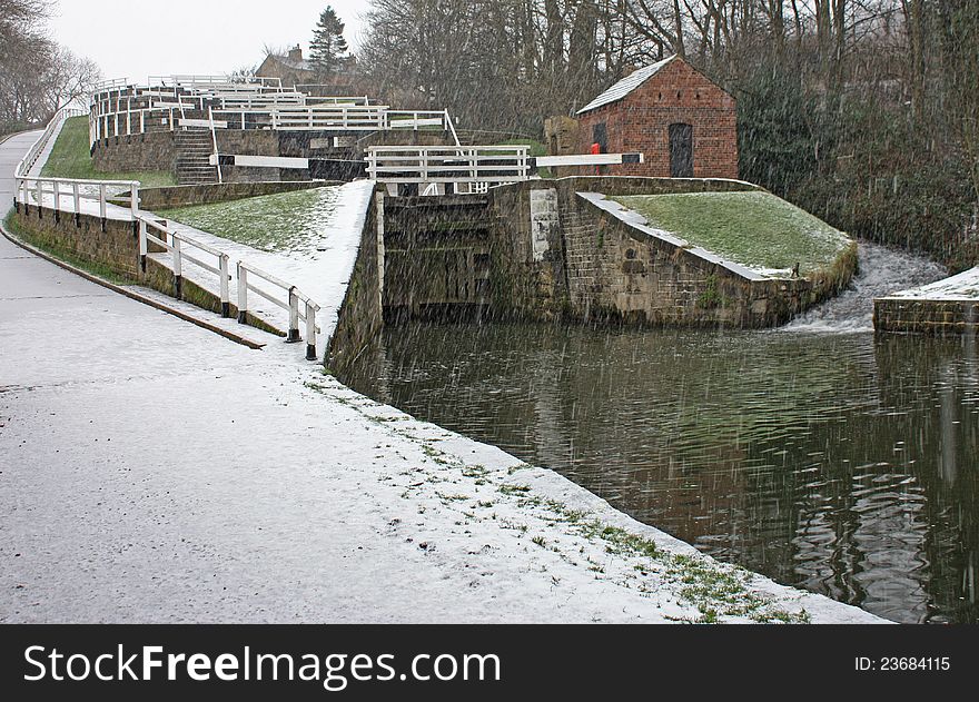 A Set of Canal Locks on a Cold Snowy Day. A Set of Canal Locks on a Cold Snowy Day.