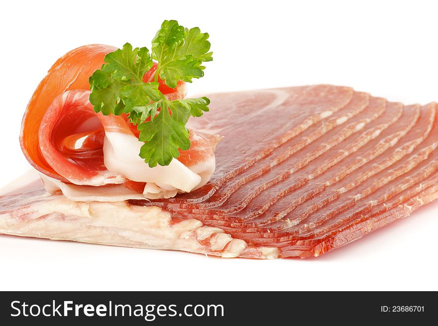 Thin slices of jamon on white background