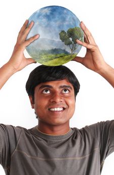 Young Man Smiling And Holding Ball With Ecosystem Stock Photography Young Man Smiling And Holding Ball With Ecosystem Stock Photography