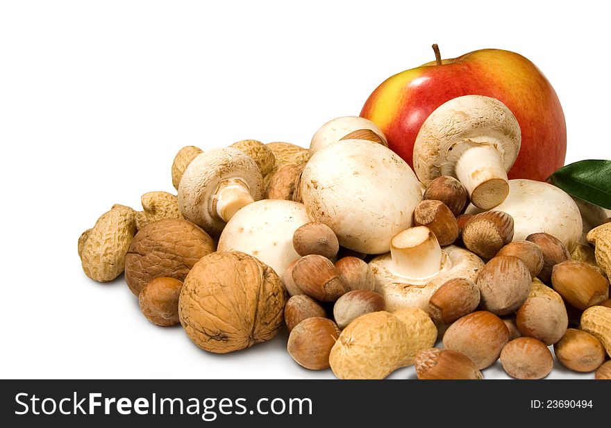 Apple, nuts and mushrooms on a white background. Apple, nuts and mushrooms on a white background