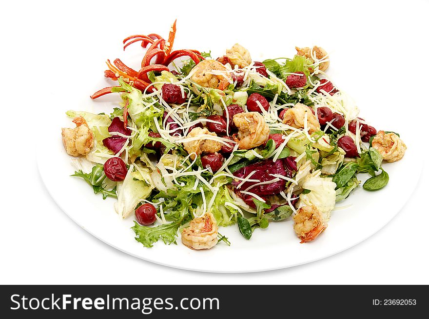 Shrimp salad with vegetables on a white background