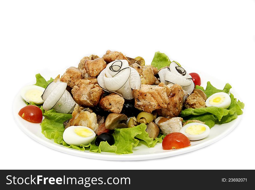 Fish meat salad on a plate on a white background. Fish meat salad on a plate on a white background