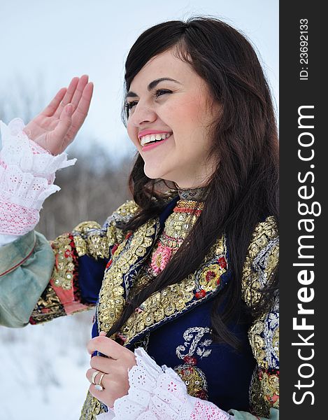 The portrait of a woman dressed in traditional Bulgarian costume.