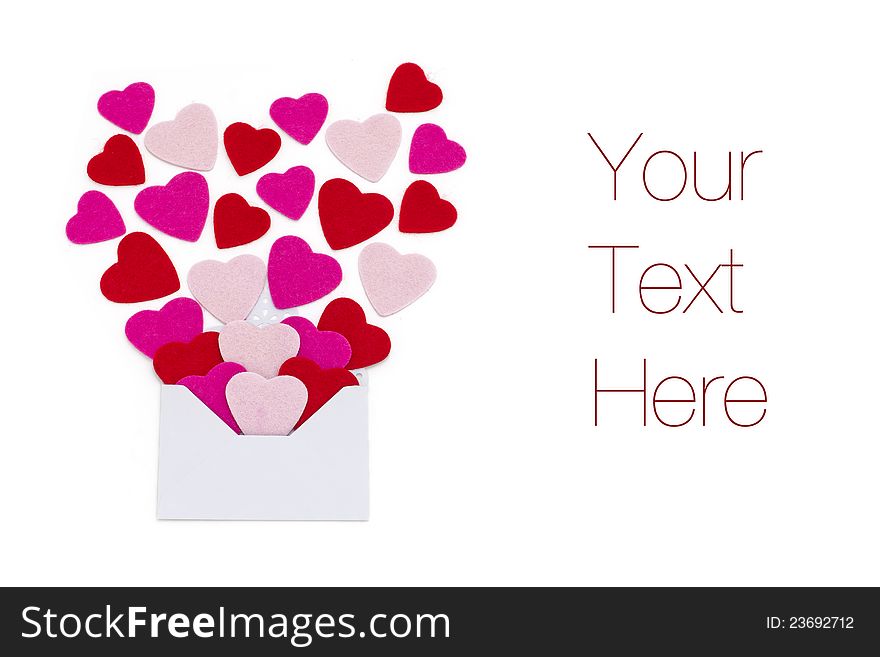 Small red and pink hearts with envelope, isolated on white, copy space. Small red and pink hearts with envelope, isolated on white, copy space