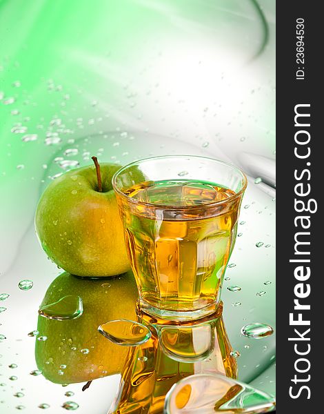 Ripe apple and juice on abstract background. Ripe apple and juice on abstract background