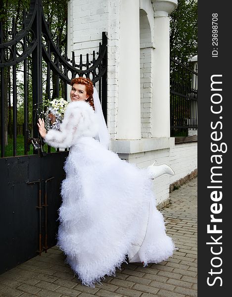 Happy bride in park