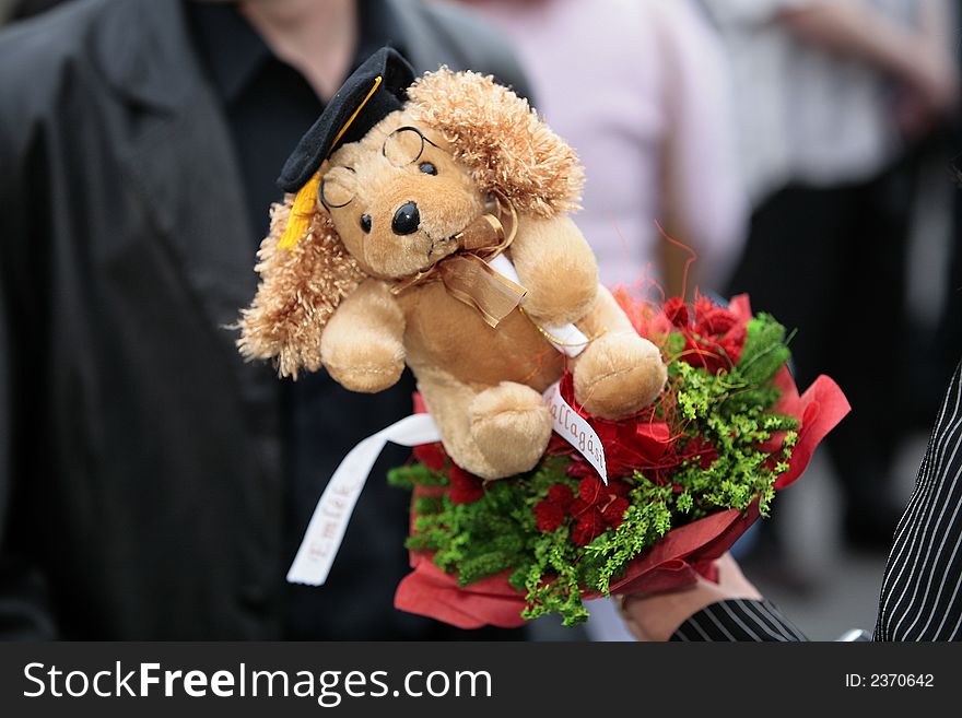 Graduation gift - a toy with red flowers. Graduation gift - a toy with red flowers