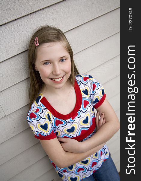 Darling and fashionable preteen girl smiling. Darling and fashionable preteen girl smiling