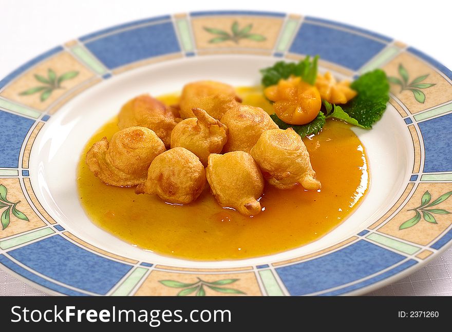 Fried mandarines with sweet sauce