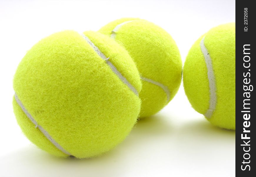 Three tennis balls on white. Three tennis balls on white