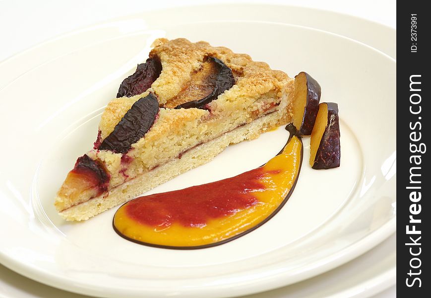 Fruit pie with yellow custard over the white background