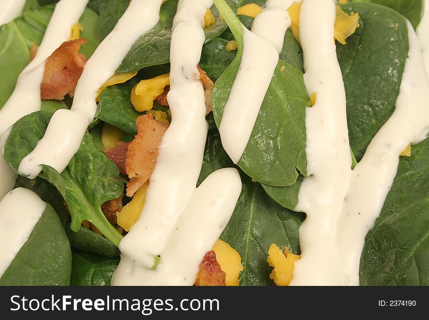 Bacon egg and cheese salad with ranch upclose background