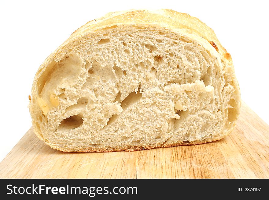 Isolated photo of homemade bread on white cutting board