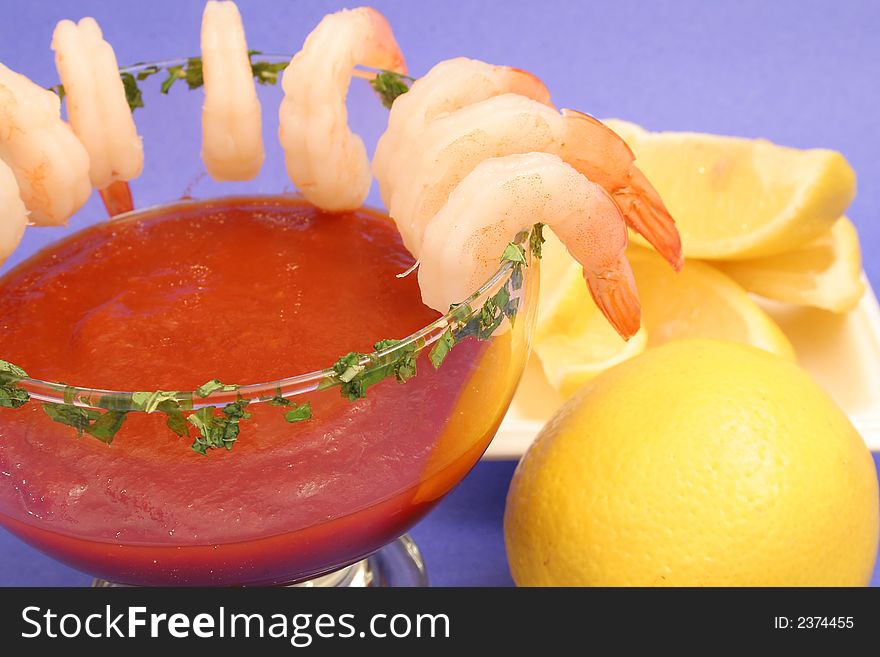 Isolated photo of a shrimp cocktail on blue