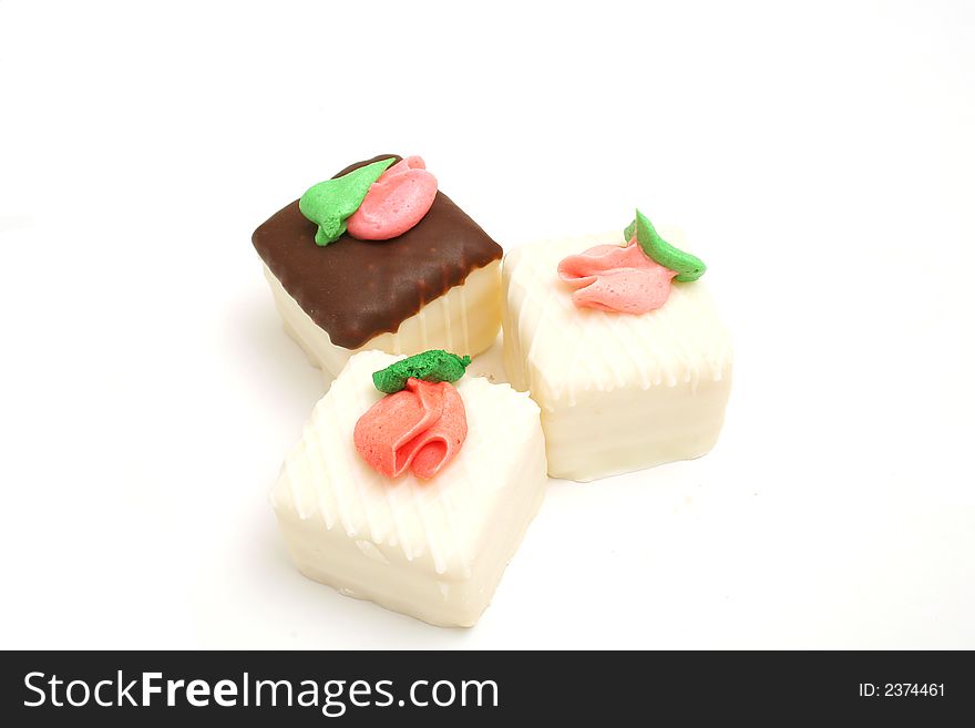 Isolated photo of a trio of cupcakes on white