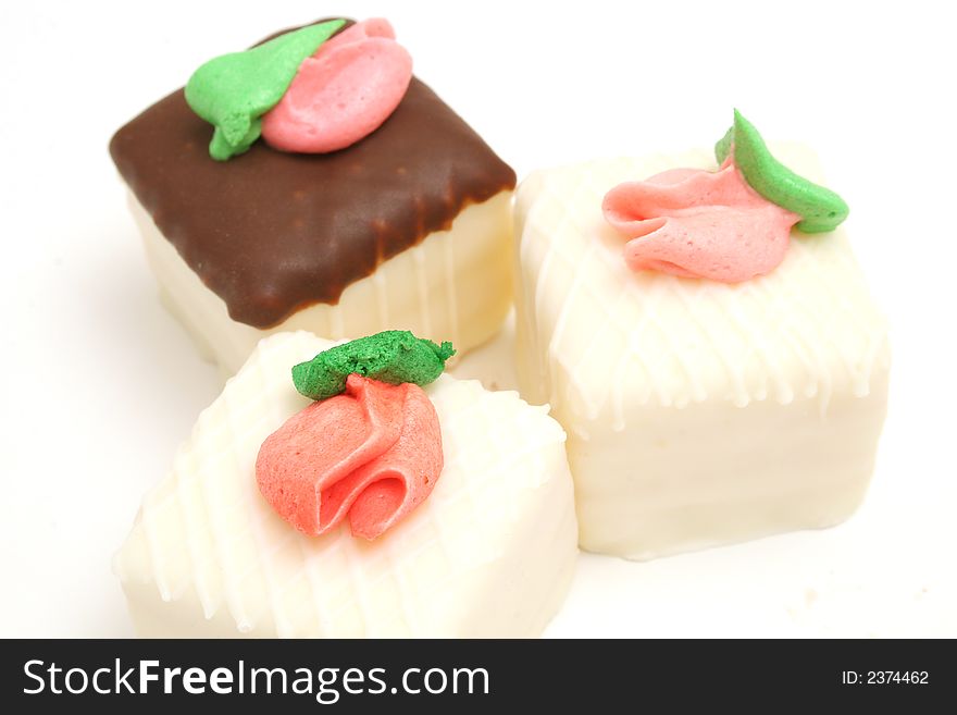 Isolated photo of a trio of cupcakes upclose on white