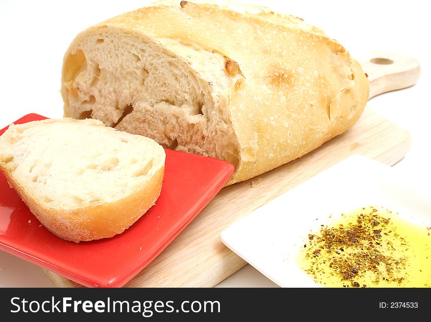 Isolated photo of bread with olive oil on white