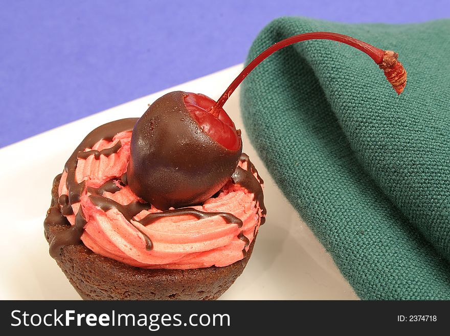 Photo of a chocolate cherry brownie dessert macro