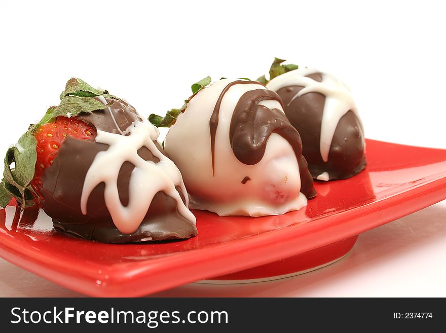 Isolated photo of chocolate covered strawberrys at an angle on white