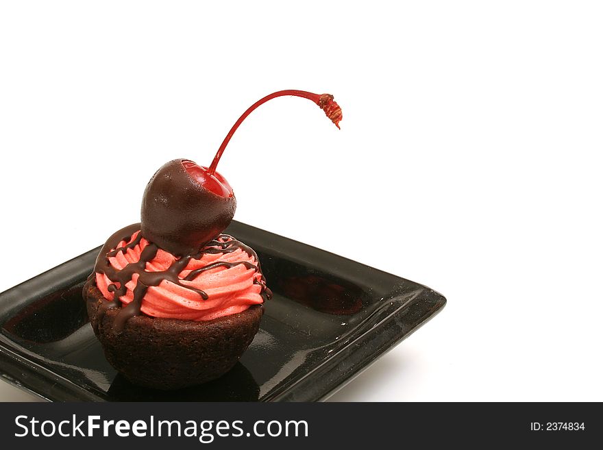 Isolated photo of a chocolate covered brownie cherry bite on white. Isolated photo of a chocolate covered brownie cherry bite on white