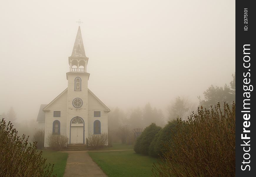 Desolate old church waiting on a foggy spring morning