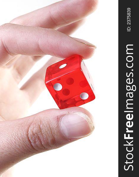 Hand with red dice isolated on white background. Hand with red dice isolated on white background