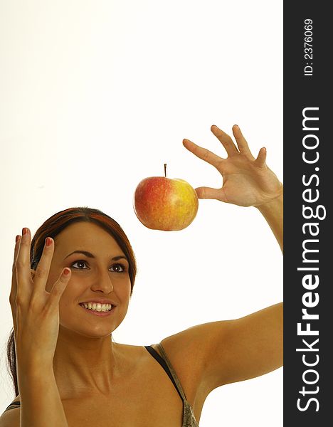 Healthy girl eating apples over a white background. Healthy girl eating apples over a white background