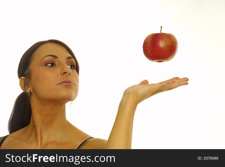 Healthy girl eating apples over a white background. Healthy girl eating apples over a white background