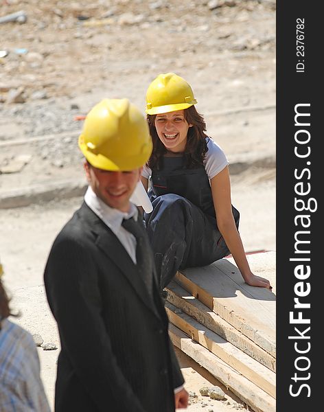 Woman and man on construction workplace. Woman and man on construction workplace