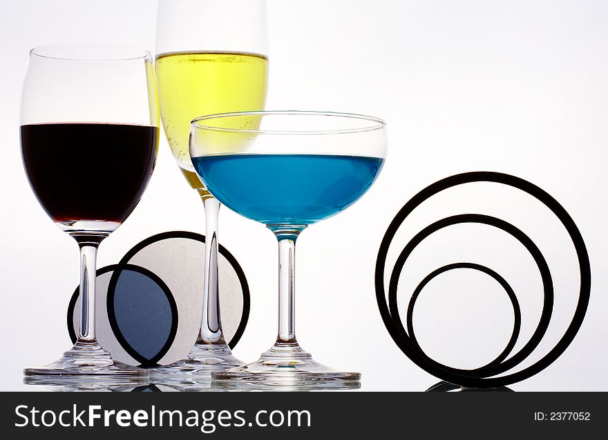 View  of three different sizes wineglasses and some figure on white sheet. View  of three different sizes wineglasses and some figure on white sheet