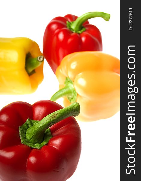 Excellent red and yellow peppers on a white background